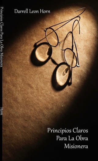 Book cover showing a decorative horn with spherical ornaments suspended against a textured brown background with dramatic lighting
